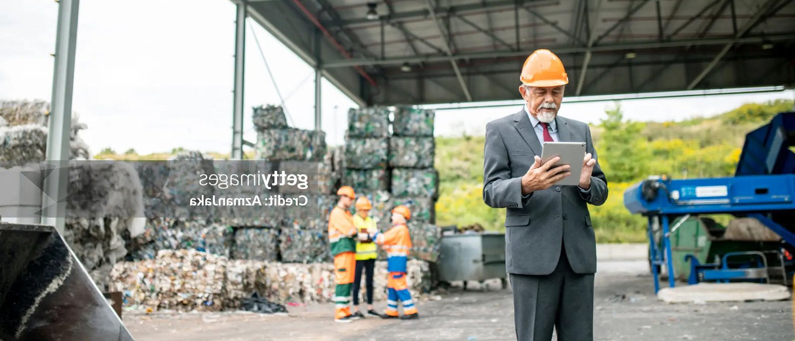 Worker in front of pallet boxes